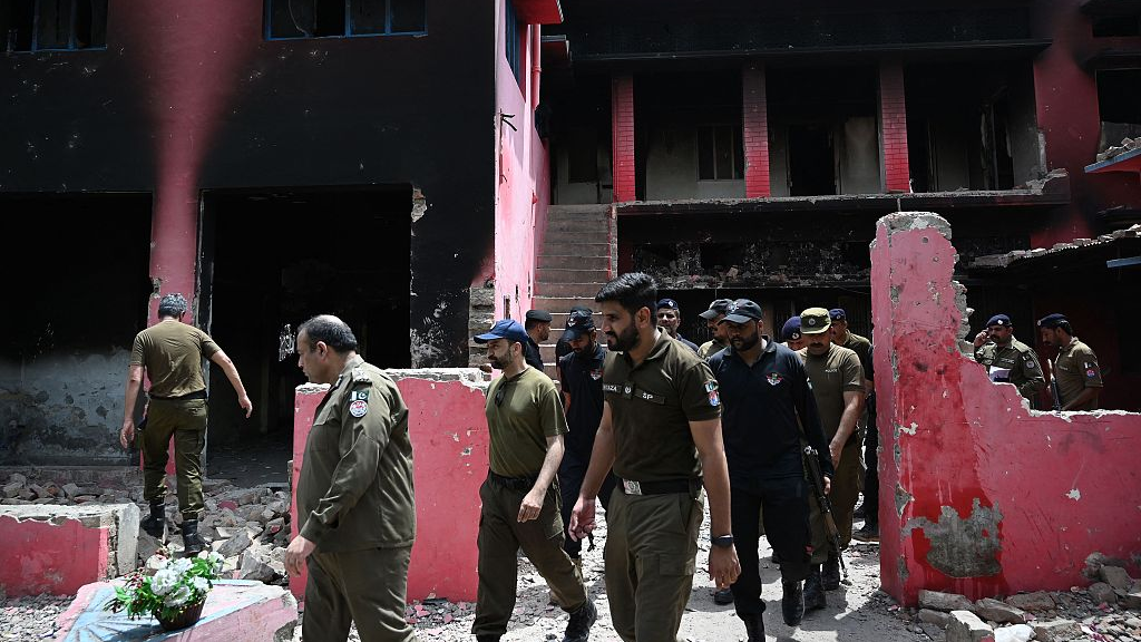 Police officials inspect a burnt Salvation Army church in Jaranwala on the outskirts of Faisalabad on August 17, 2023. /CFP