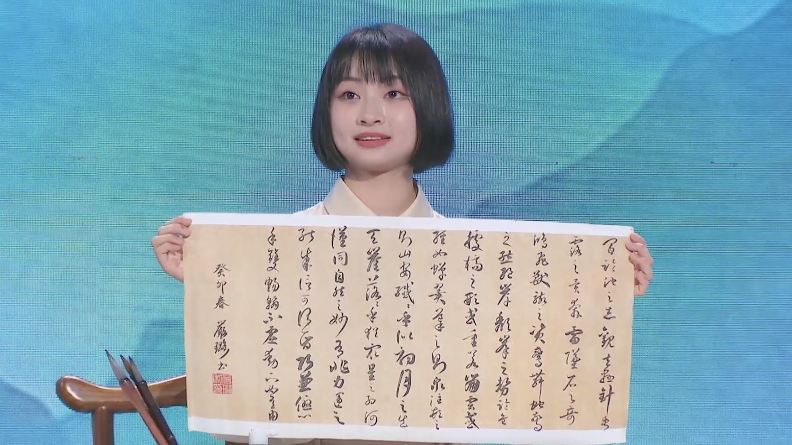A calligraphy enthusiast showcases her copy of 