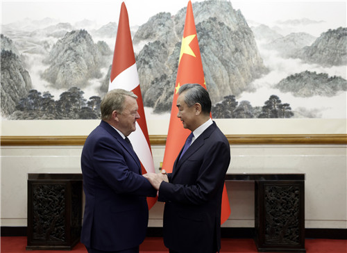 Chinese Foreign Minister Wang Yi (R) shakes hands with Minister for Foreign Affairs of Denmark Lars Lokke Rasmussen in Beijing, China, August 18, 2023. /Chinese Foreign Ministry