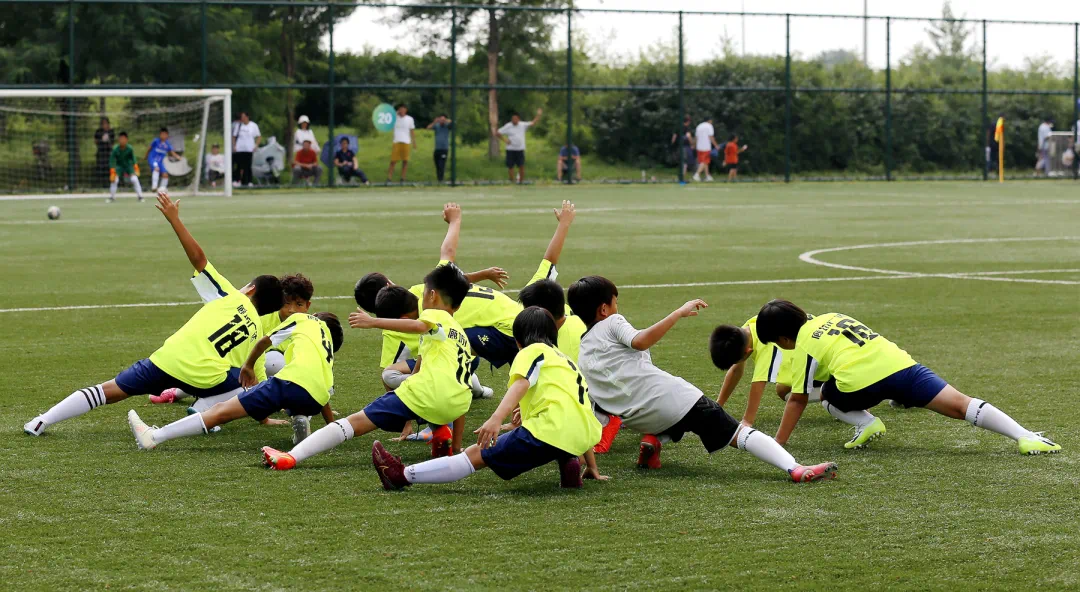 Young players warm up before a match in Shenyang, China. /Peace Cup