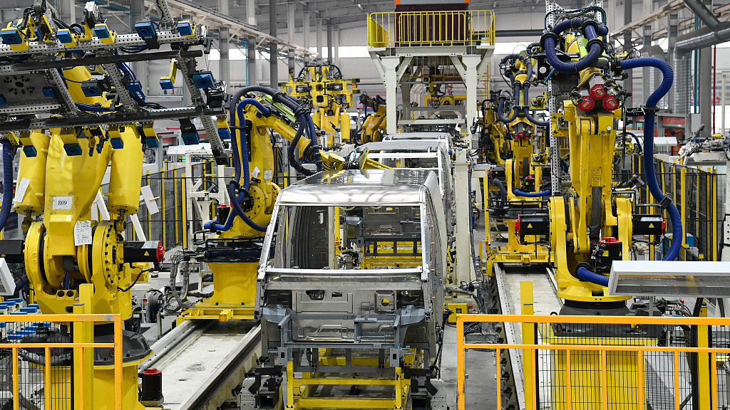 A robot rivets an all-aluminum logistics vehicle body on an integrated production line in Zouping City, Shandong Province, east China, February 9, 2023. /CFP