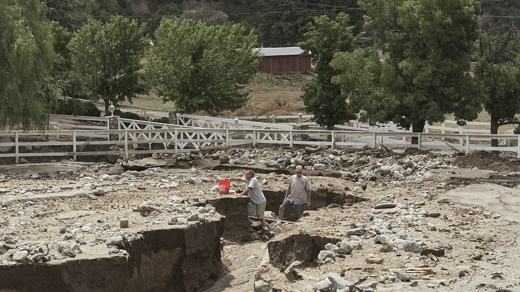 People inspect their property after it was damaged from flooding due to Tropical Storm Hilary, August 21, 2023, Yucaipa, California. /CFP