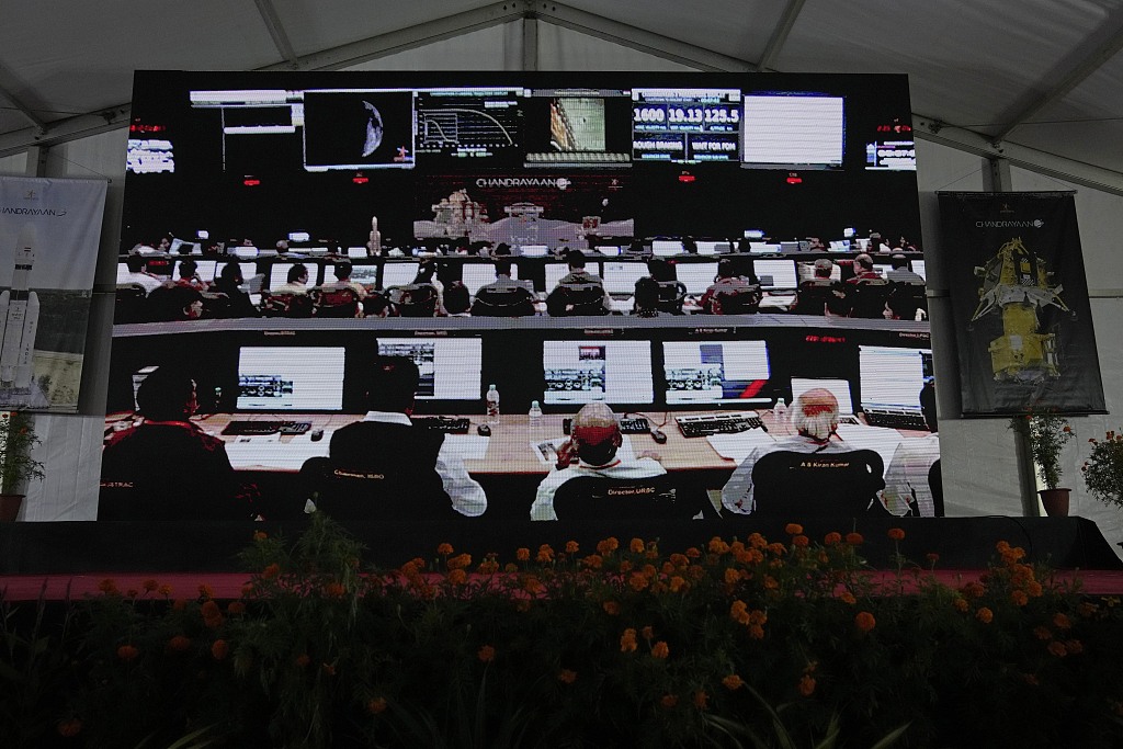 ISRO scientists are projected on a screen waiting for the landing of spacecraft Chandrayaan-3 on the moon at ISRO's Telemetry, Tracking and Command Network facility in Bengaluru, India, August 23, 2023. /CFP