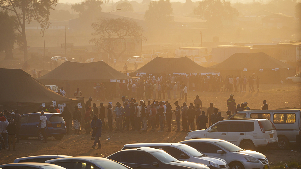 Voters wait in queue to cast their votes at a polling station in Harare, August 23, 2023. /CFP