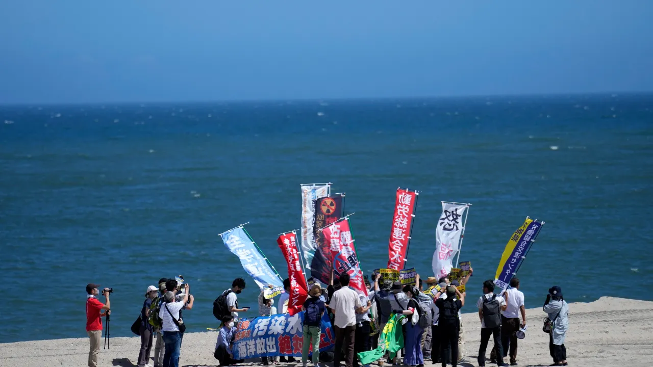 People protest at a beach toward the Fukushima Daiichi nuclear power plant, damaged by a massive March 11, 2011, earthquake and tsunami, in Namie town, northeastern Japan, Thursday, August 24, 2023. /CFP