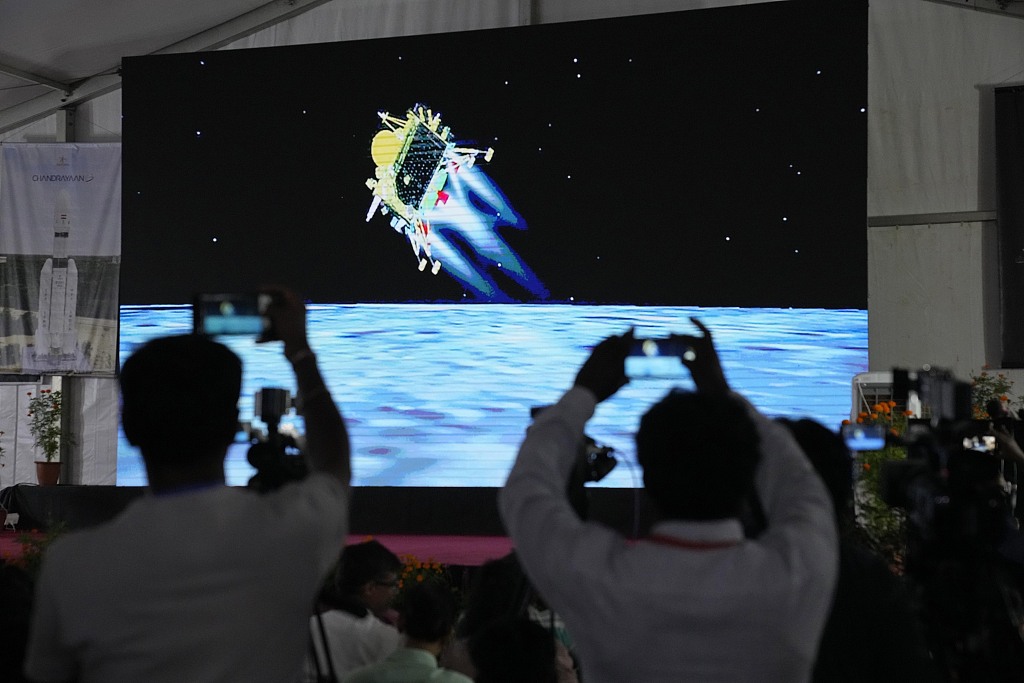 Journalists film the live telecast of spacecraft Chandrayaan-3 landing on the moon at ISRO's Tracking and Command Network facility in Bengaluru, India, August 23, 2023. /CFP