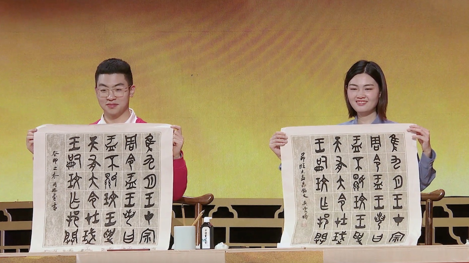 Calligraphy enthusiasts showcase their copies of the inscriptions on the Da Yu Ding, a significant bronze vessel from the Western Zhou Dynasty (1046-771 BC). /CGTN