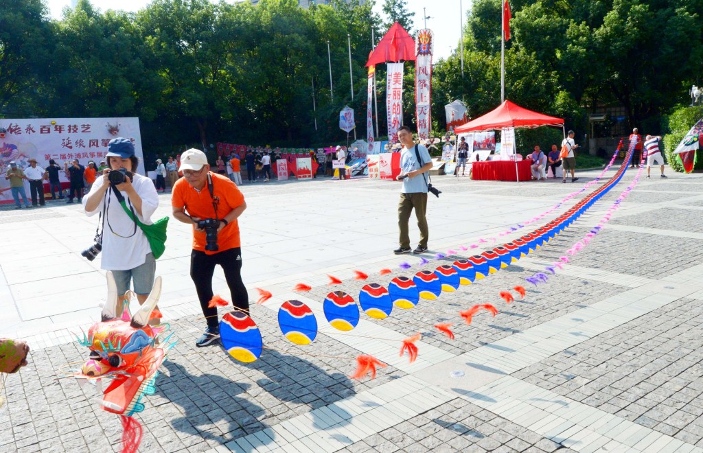 A dragon-shaped kite is seen during a kite show held on August 24, 2023 at The Bund in Shanghai. /CFP