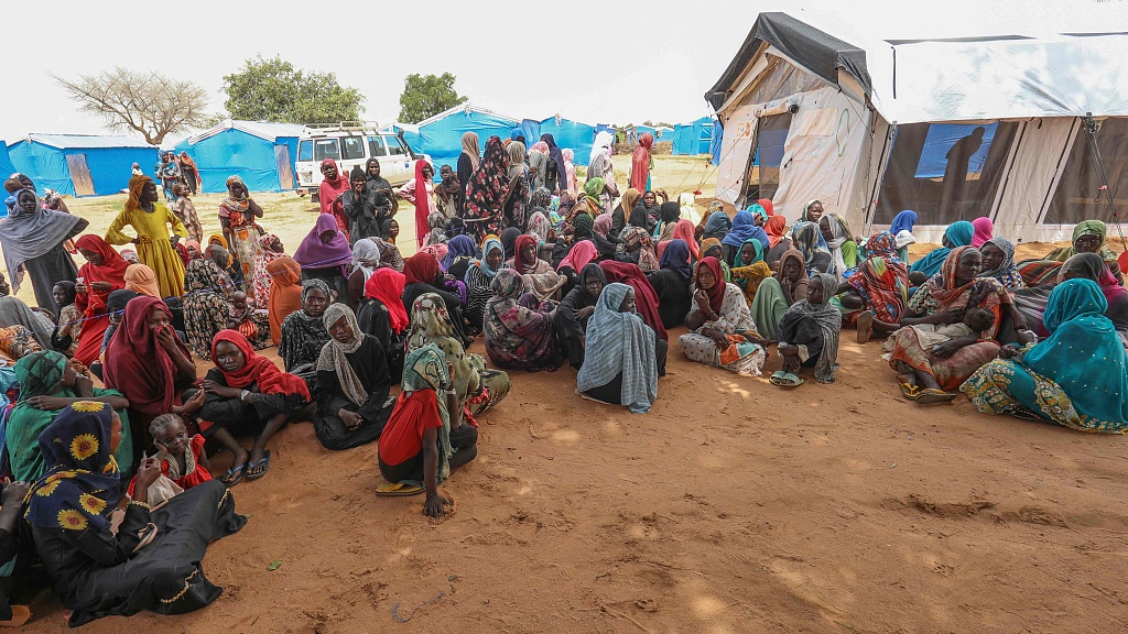 Women who fled the war in Sudan await the distribution of international aid rations at the Ourang refugee camp, near Adre town in eastern Chad,  August 15, 2023. /CFP