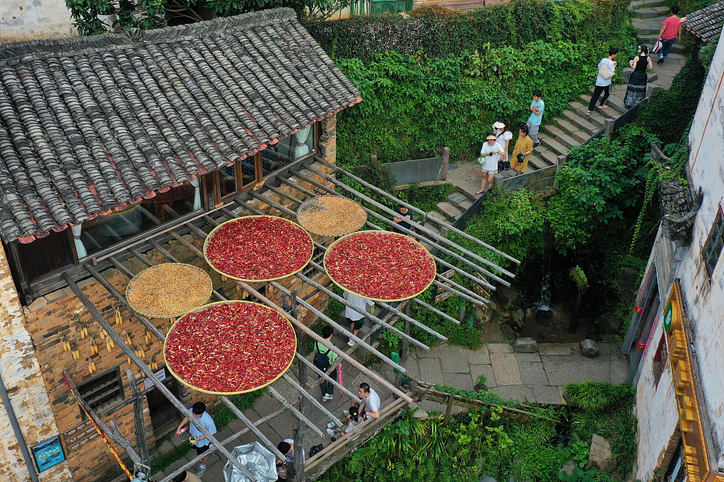 Tourists visit Huangling Village in Wuyuan County, Jiangxi Province, August 26, 2023. /CFP