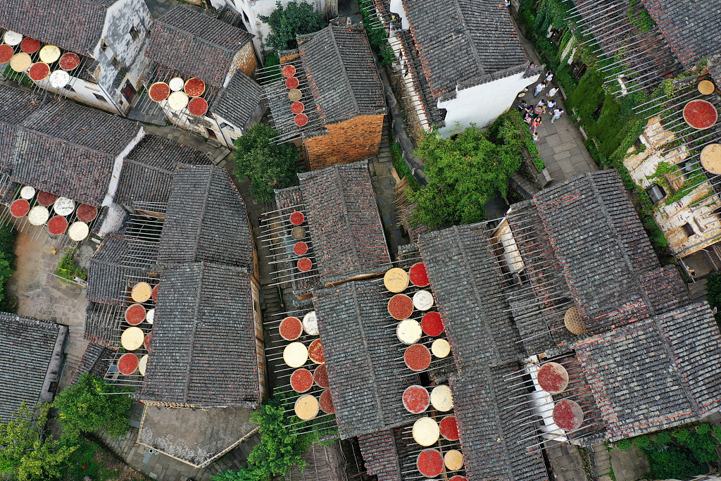 Villagers dry their harvested crops under the sun in Wuyuan County, Jiangxi Province, August 26, 2023. /CFP