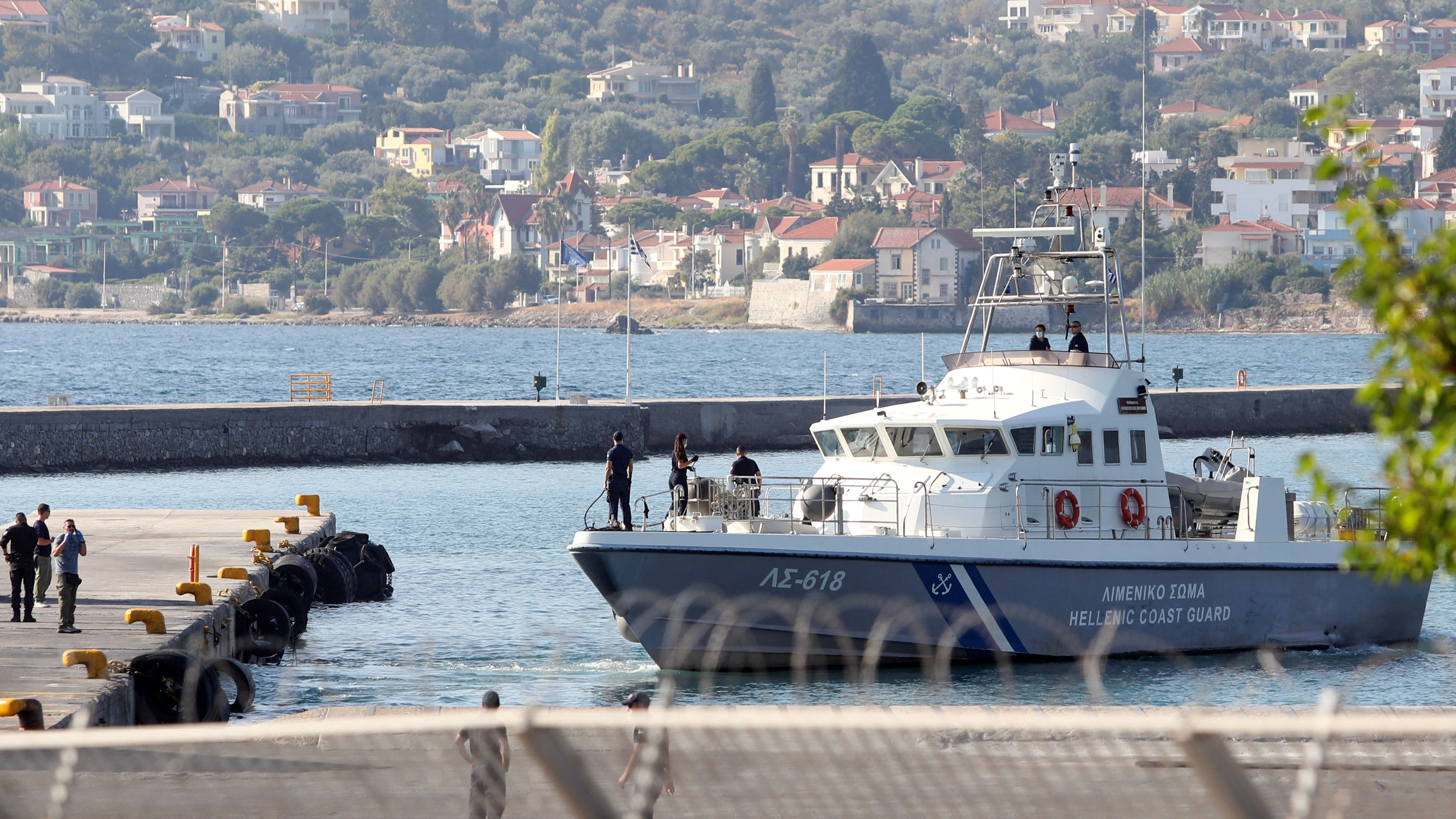 A Hellenic Coast Guard vessel with rescued migrants onboard prepares to moor at the port of Mytilene, following a shipwreck in which four migrants drowned, off the island of Lesbos, Greece, August 28, 2023. /Reuters