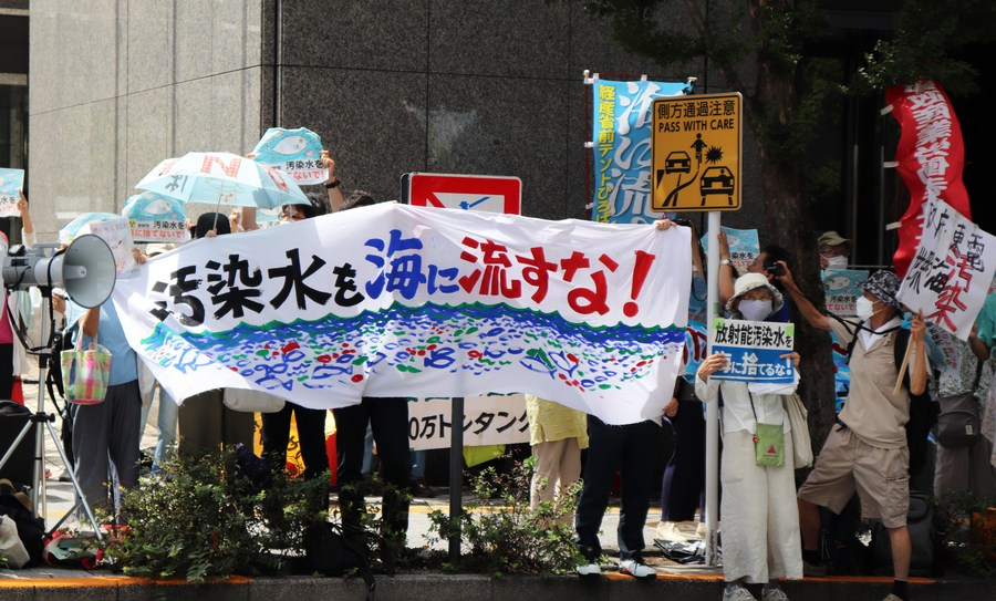 People gather to protest the Japanese government and Tokyo Electric Power Company's (TEPCO) decision on releasing nuclear-contaminated water in front of the headquarters of the TEPCO in Tokyo, Japan, August 24, 2023. /Xinhua