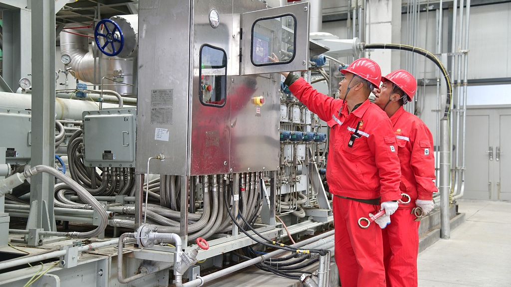 Workers check at the Shanggu Natural Gas Processing Plant of the Changqing Oilfield, Qinhe Town, Yulin City, northwest China's Shaanxi Province, October 5, 2021. /CFP