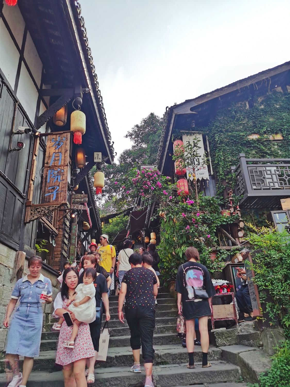 Tourists visit Ciqikou ancient town in southwest China's Chongqing on August 21, 2023. /CGTN