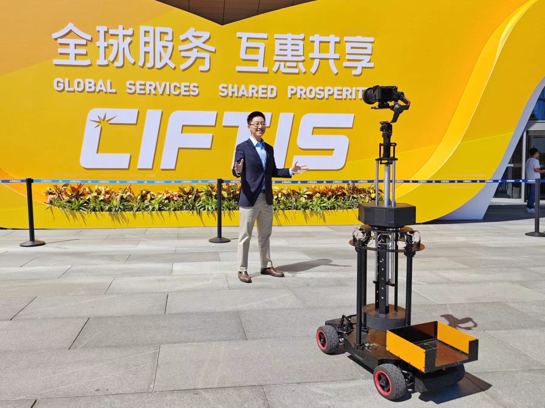 A CGTN reporter is filming for a promo video at the China National Convention Center in Beijing, August 29, 2023. /CGTN
