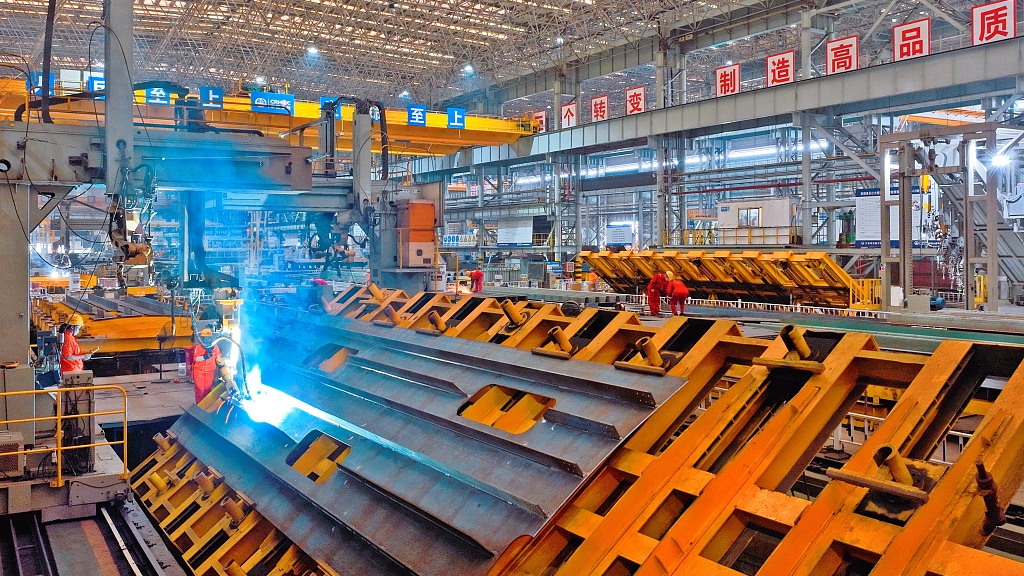 A robot welds steel components in the intelligent welding workshop of China Railway Shanqiao Co., LTD in Nantong, Jiangsu Province, Aug 25, 2023./CFP