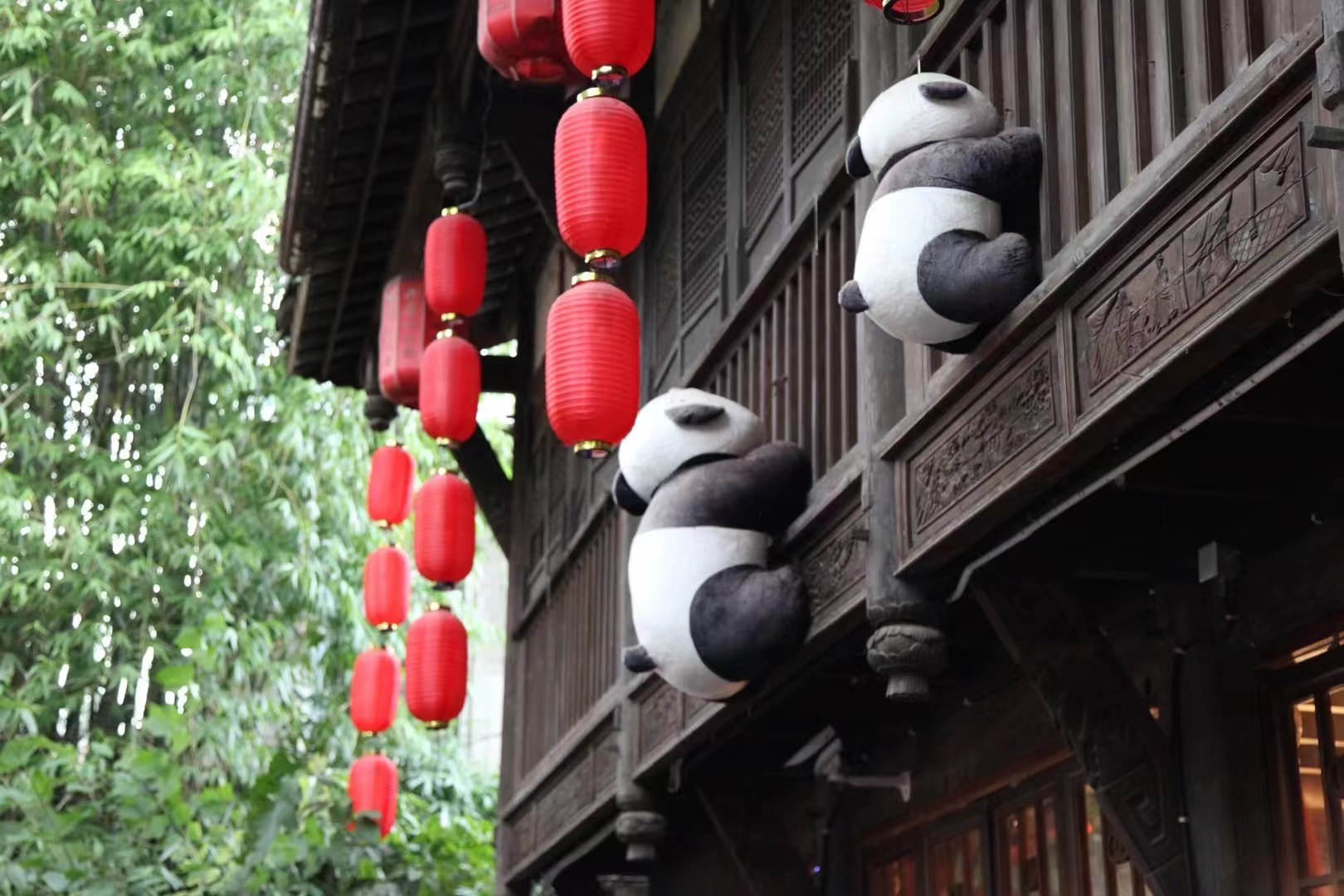 A building in the ancient style is decorated with panda toys in Jinli Ancient Street in Chengdu, Sichuan Province. /CGTN