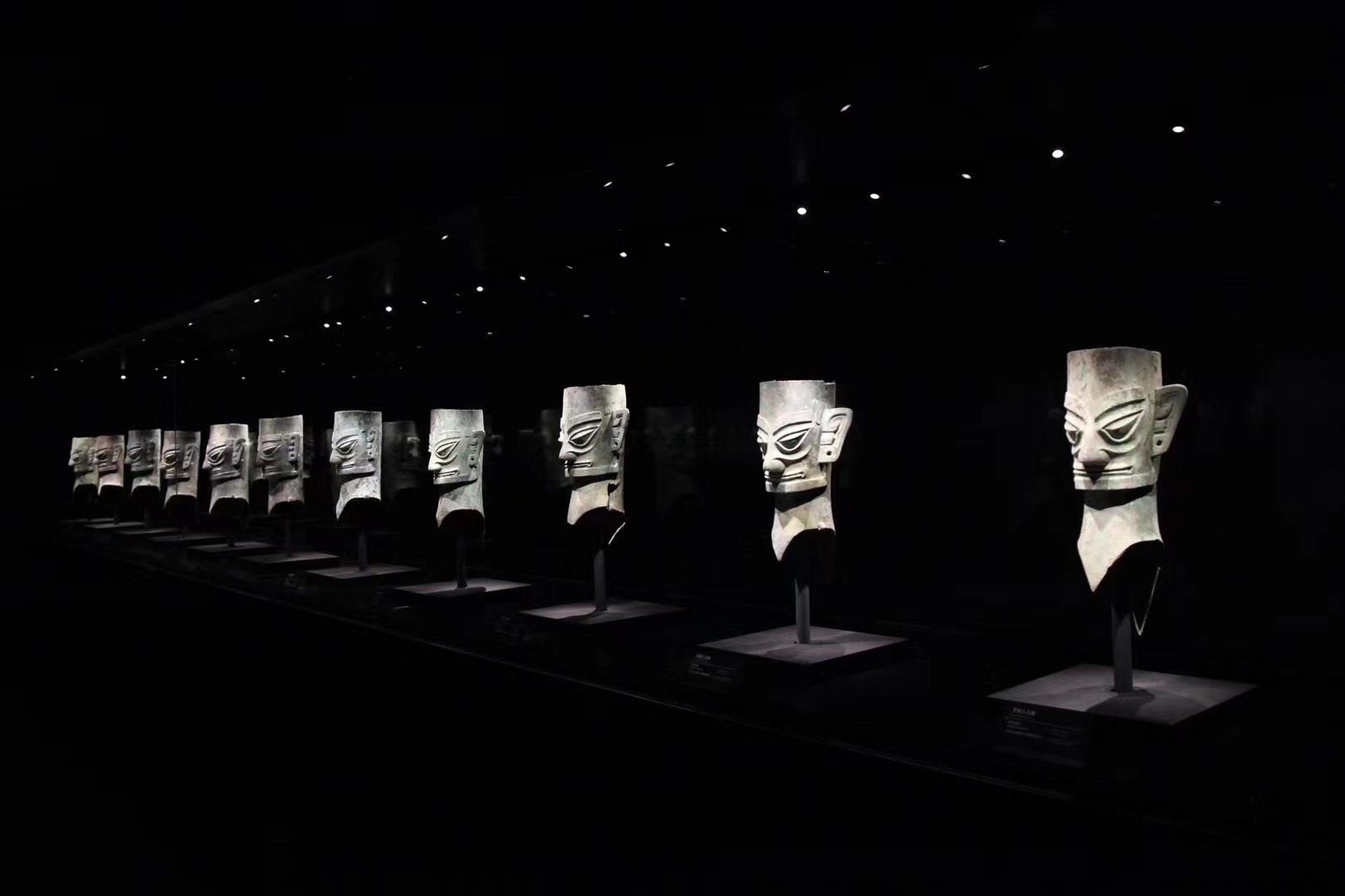 Bronze heads are on display at the new building of the Sanxingdui Museum in Guanghan, Sichuan Province. /CGTN