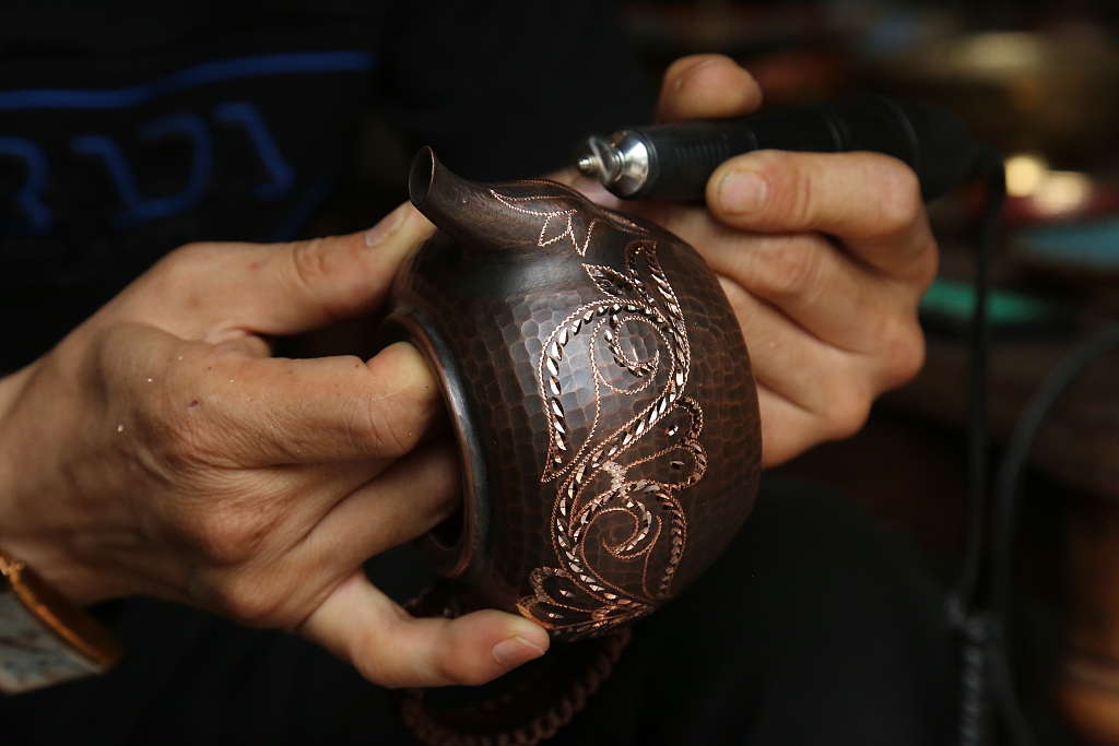 A photo taken on August 28, 2023 shows the detail of copperware in Kuqa of Aksu Prefecture in Xinjiang. /CFP
