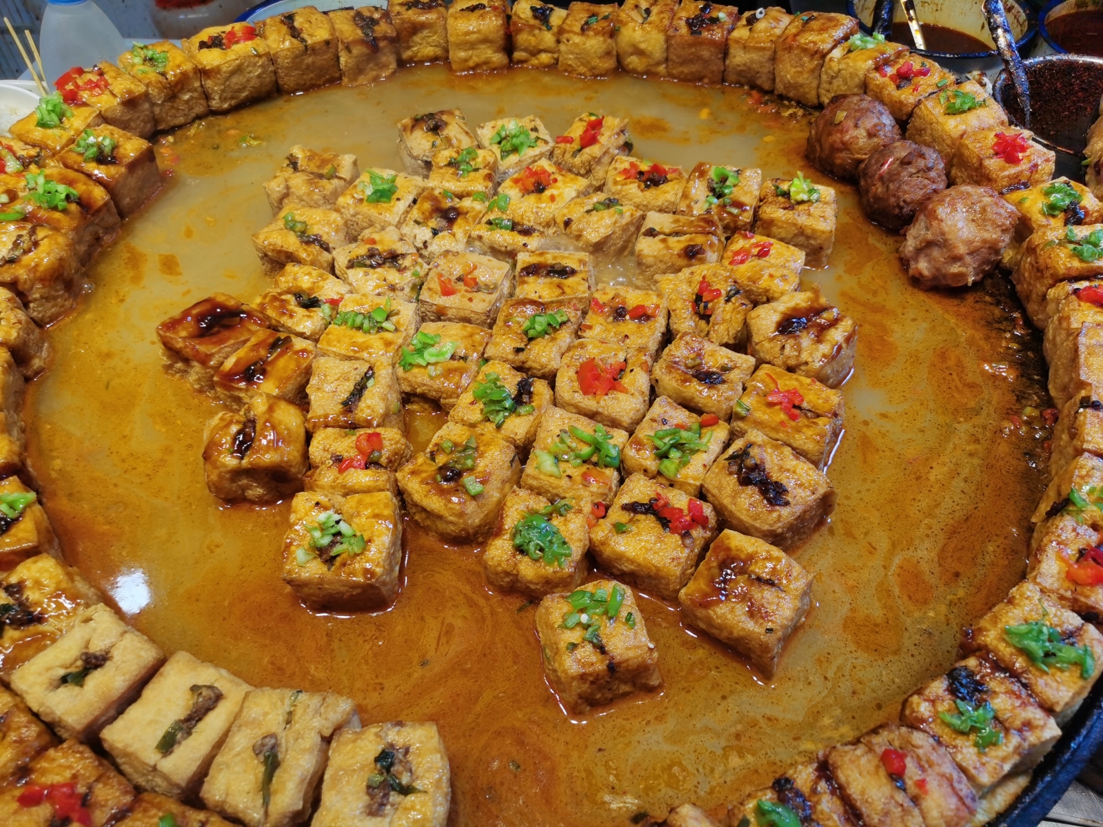 A photo taken on August 21, 2023 shows tofu snacks at Ciqikou ancient town in southwest China's Chongqing. /CGTN