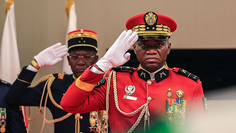 Brice Oligui Nguema (R) salutes as he is inaugurated as Gabon's 