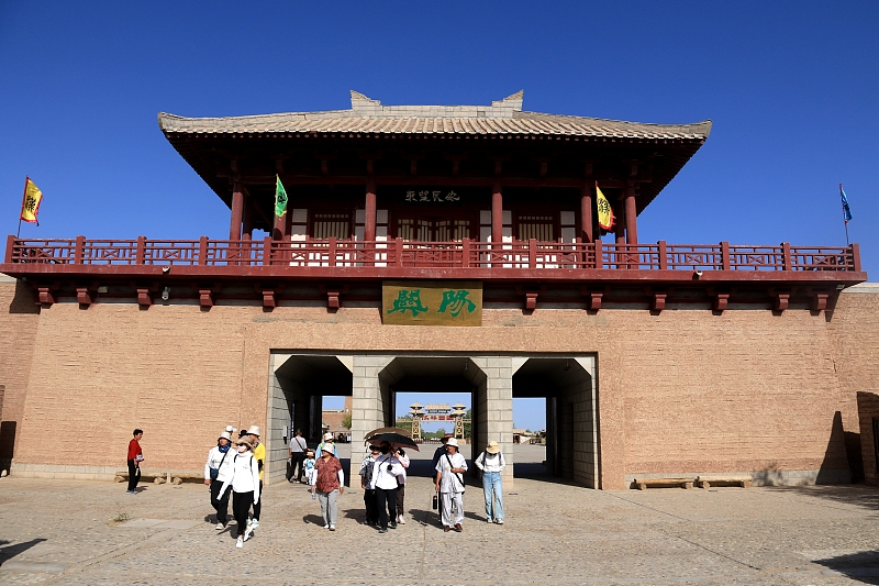 The file photo shows tourists visiting Yangguan Pass scenic spot in Dunhuang City, Gansu Province. /CFP