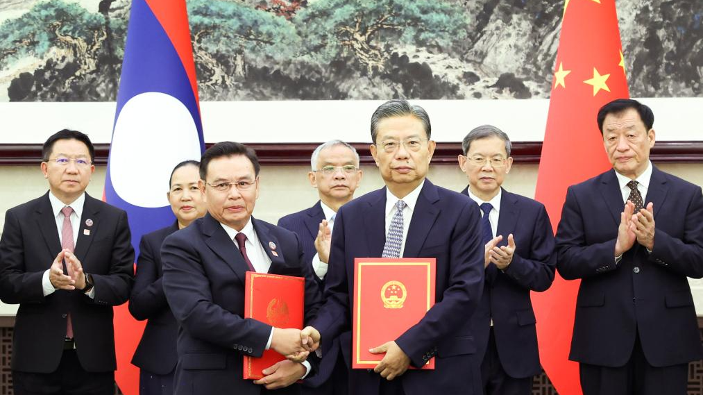 Zhao Leji, chairman of the National People's Congress (NPC) Standing Committee, and visiting Lao National Assembly President Saysomphone Phomvihane signed an agreement on cooperation between the NPC and the Lao National Assembly after their talks at the Great Hall of the People in Beijing, capital of China, September 4, 2023. /Xinhua 
