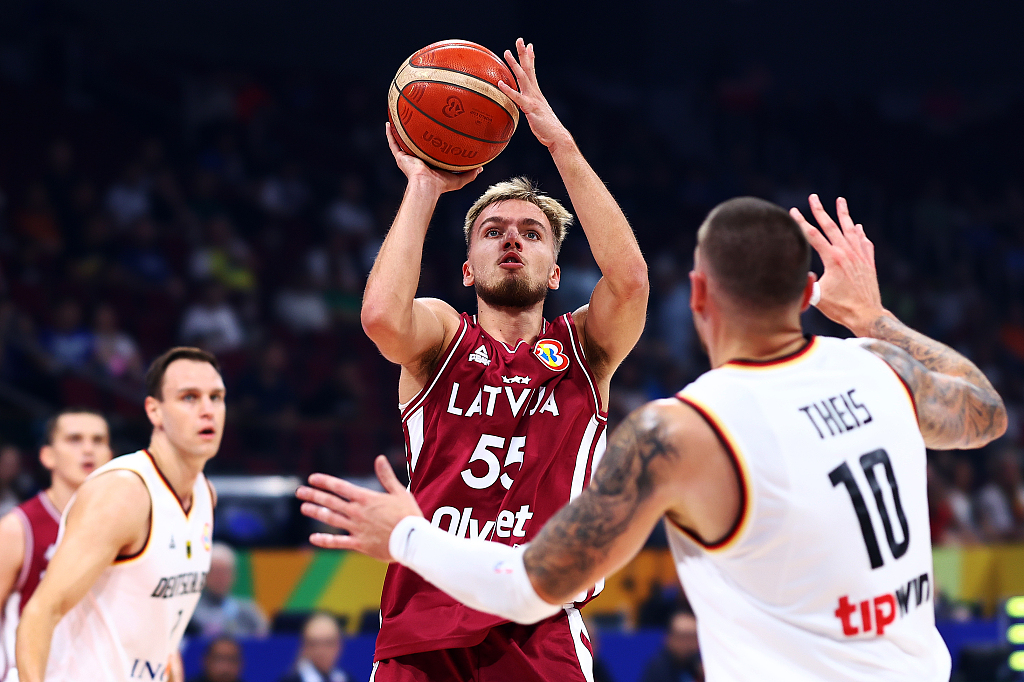 Arturs Zagars (#55) of Latvia shoots in the FIBA Basketball World Cup quarterfinals against Germany at Mall of Asia Arena in Manila, the Philippines, September 6, 2023. /CFP