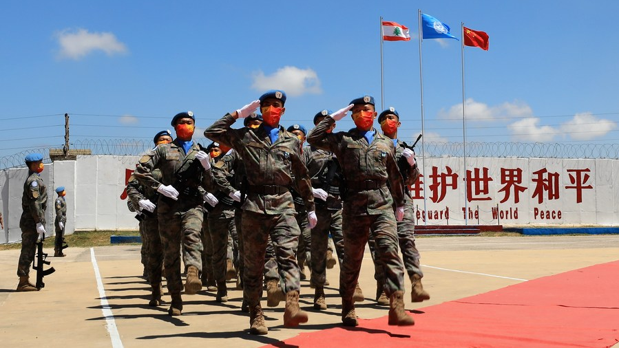 Chinese peacekeepers march at a medal parade ceremony in Hanniyah village, southern Lebanon, July 1, 2022. /Xinhua