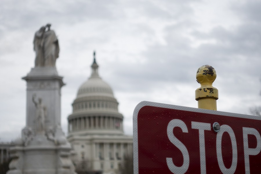 The Capitol and a stop sign are seen in Washington D.C., the United States, February 13, 2020. /Xinhua