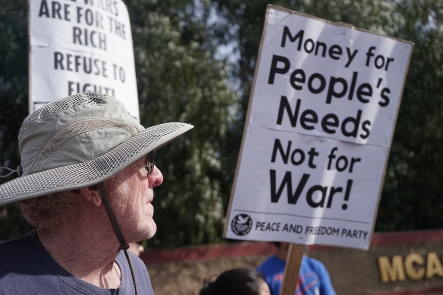 A protester is seen in front of Marine Corps Air Station Miramar, north of downtown San Diego, California, the U.S., March 18, 2023. /Xinhua