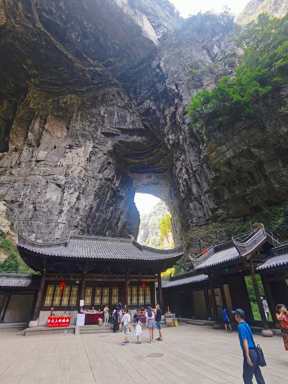 Tourists visit Three Natural Bridges scenic spot in southwest China's Chongqing, on August 23, 2023. /CGTN