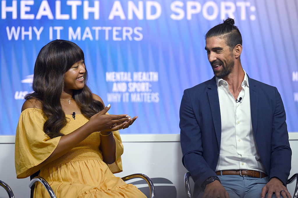 Naomi Osaka (L) and Michael Phelps speak at a forum on mental health during the U.S. Open tennis tournament in New York, U.S., September 6, 2023. /CFP