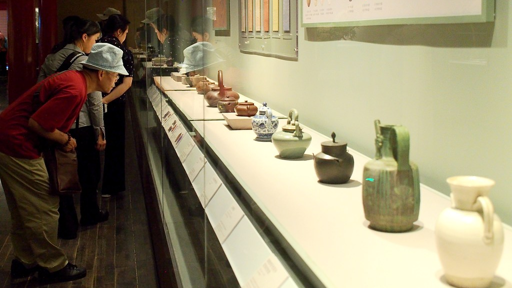 Photo taken on September 6, 2023 shows visitors taking a close look at the exhibits on display at the Palace Museum in Beijing. /CFP