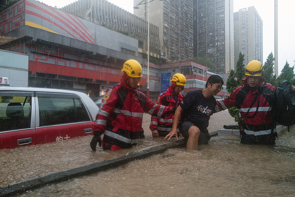 Emergency responders aid residents stranded in floodwater during heavy rain in Hong Kong SAR, China, September 8, 2023. /CFP 