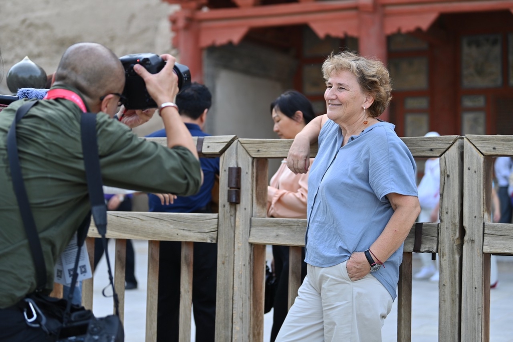 Alicia Relinque, Spanish sinologist and translator, visits the Mogao Caves in Gansu Province on September 5, 2023. /IC