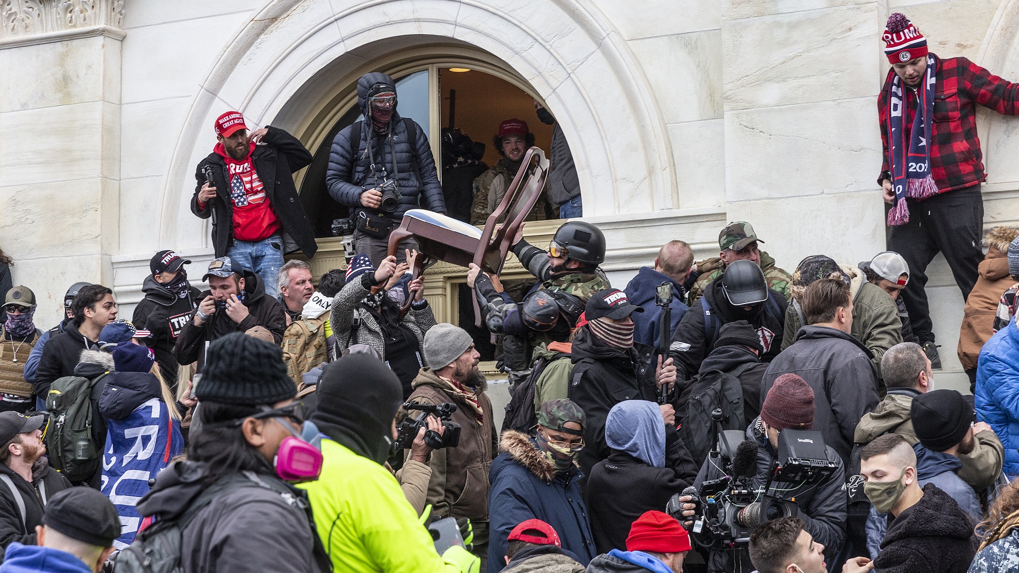 Some rioters breached through the windows into Capitol building and threw furniture out in Washington, D.C., U.S., January 6, 2021. /VCG