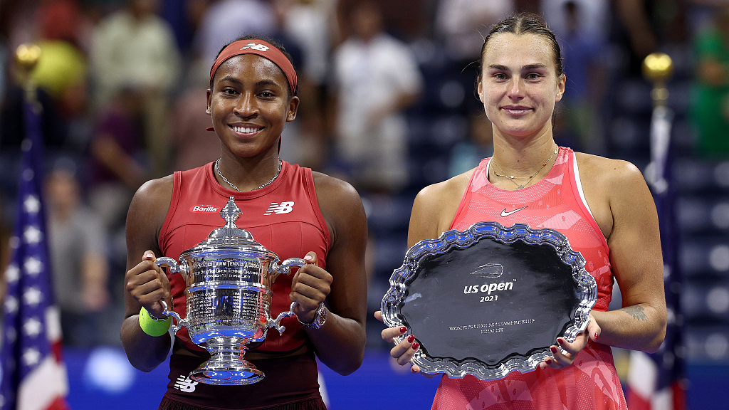Coco Gauff (L) and Aryna Sabalenka celebrate with their trophies after the U.S. Open women's singles final in New York, U.S., September 9, 2023. /CFP