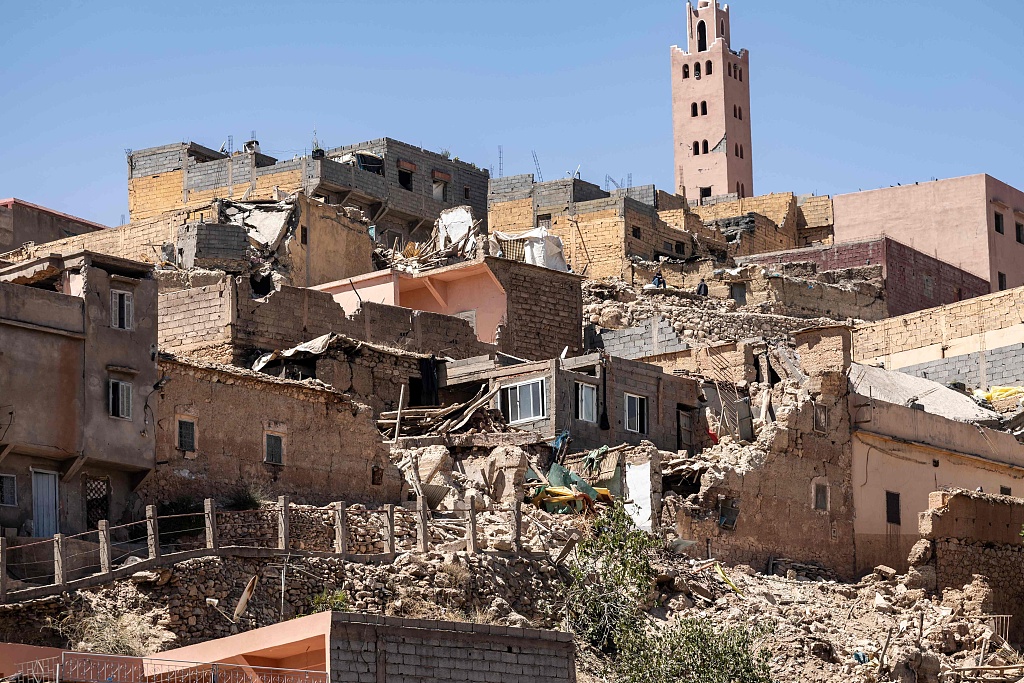 The minaret of a mosque stands behind damaged or destroyed houses following an earthquake in Moulay Brahim, Al-Haouz province, Morocco, September 9, 2023. /CFP