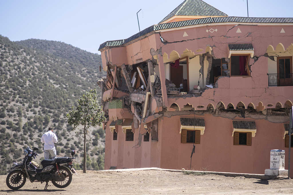 A man stands next to a damaged hotel after the earthquake in Moulay Ibrahim village, near the epicenter of the earthquake, outside Marrakech, Morocco, September 9, 2023. /CFP