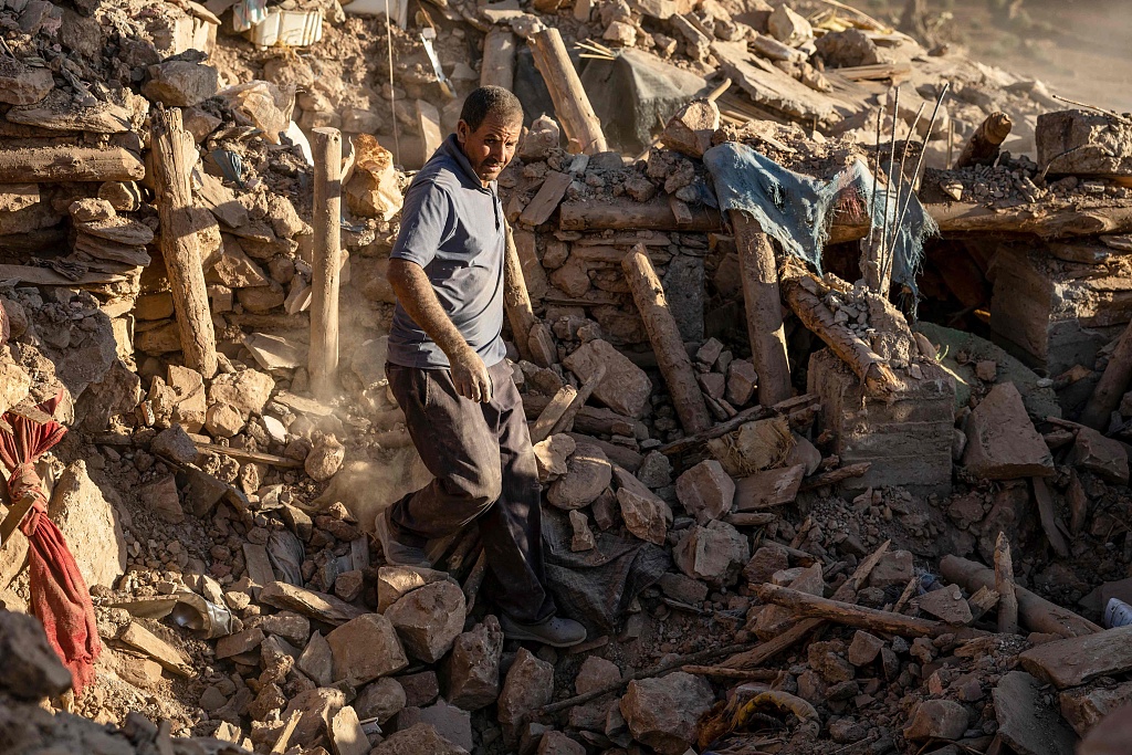 A villager searches for survivors amidst the rubble after an earthquake in the mountain village of Tafeghaghte, southwest of the city of Marrakesh, Morocco, September 9, 2023. /CFP