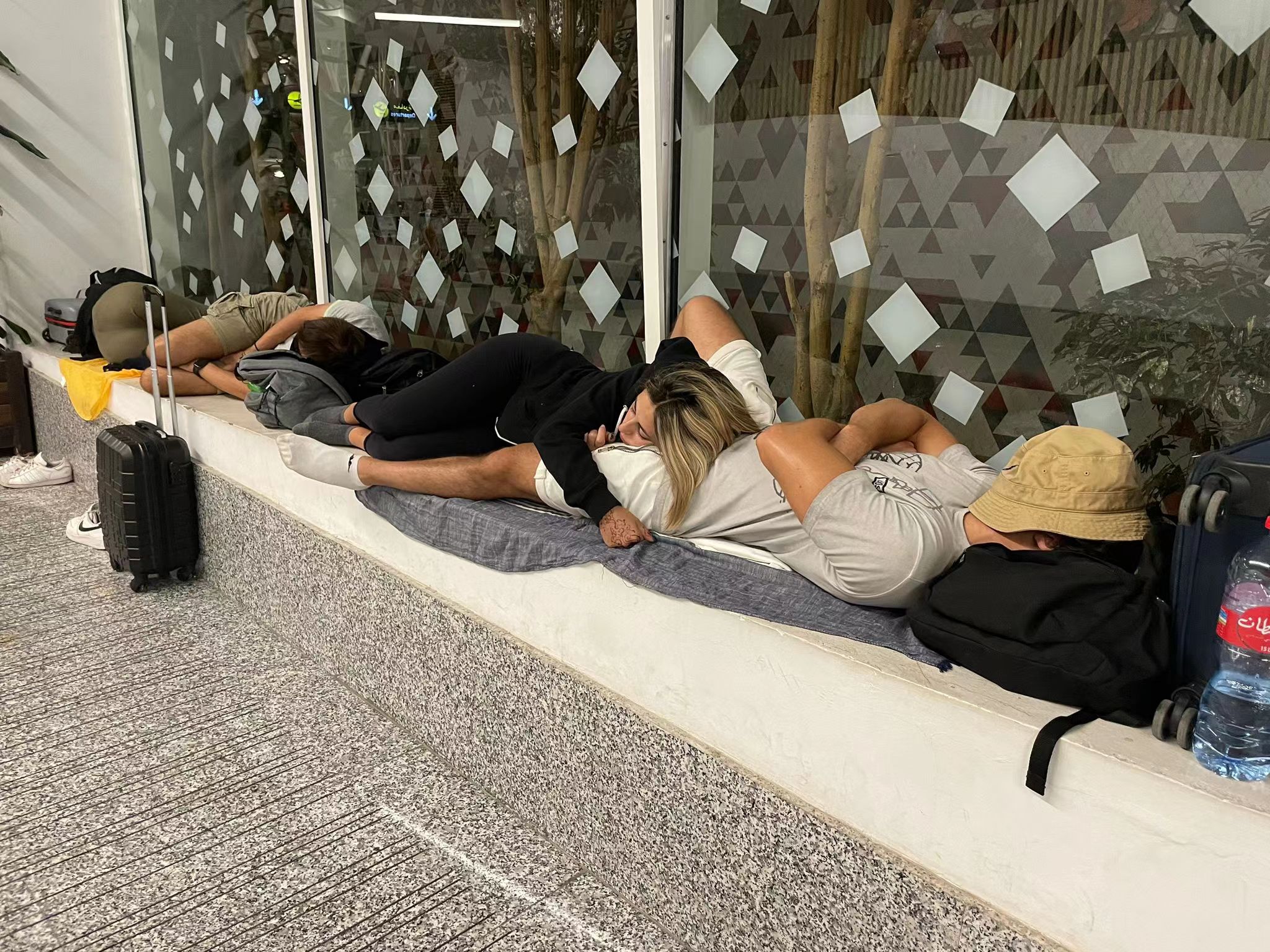 People sleep in Menara Airport after a magnitude-6.8 earthquake hit Morocco, September 9, 2023. Ken Browne/CGTN