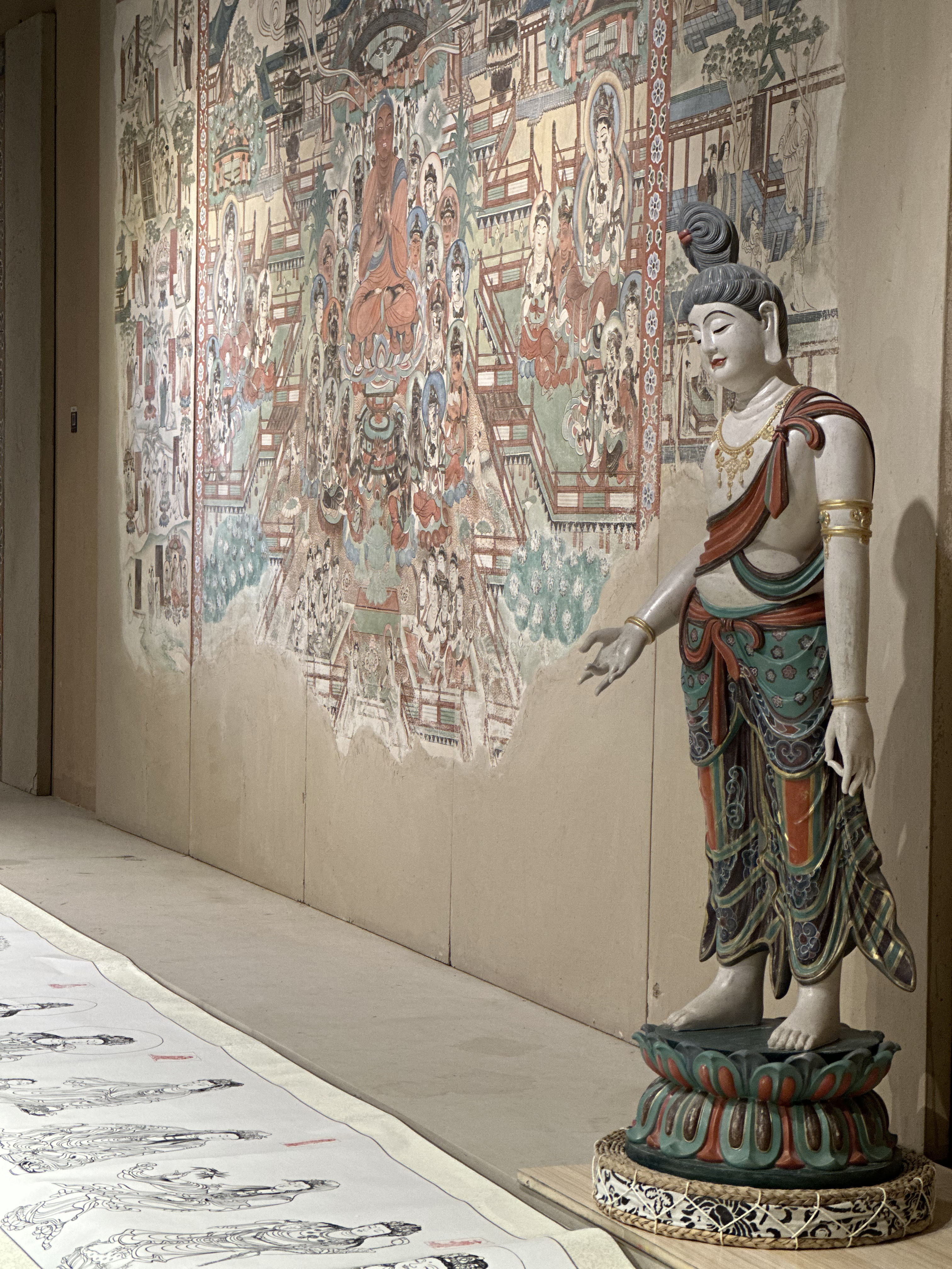 A hand-painted copy of a Dunhuang mural is photographed at the Dunhuang Art Academy, adjacent to the famous Mingsha Mountain and Crescent Spring Scenic Area in Dunhuang, northwest China's Gansu Province, on September 9, 2023. /CGTN