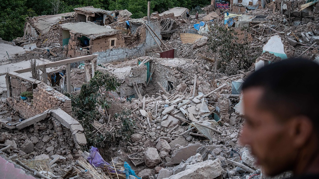 A man looks at the rubble of homes in the mountain village of Imi N'Tala, south of Marrakesh, September 10, 2023. /CFP