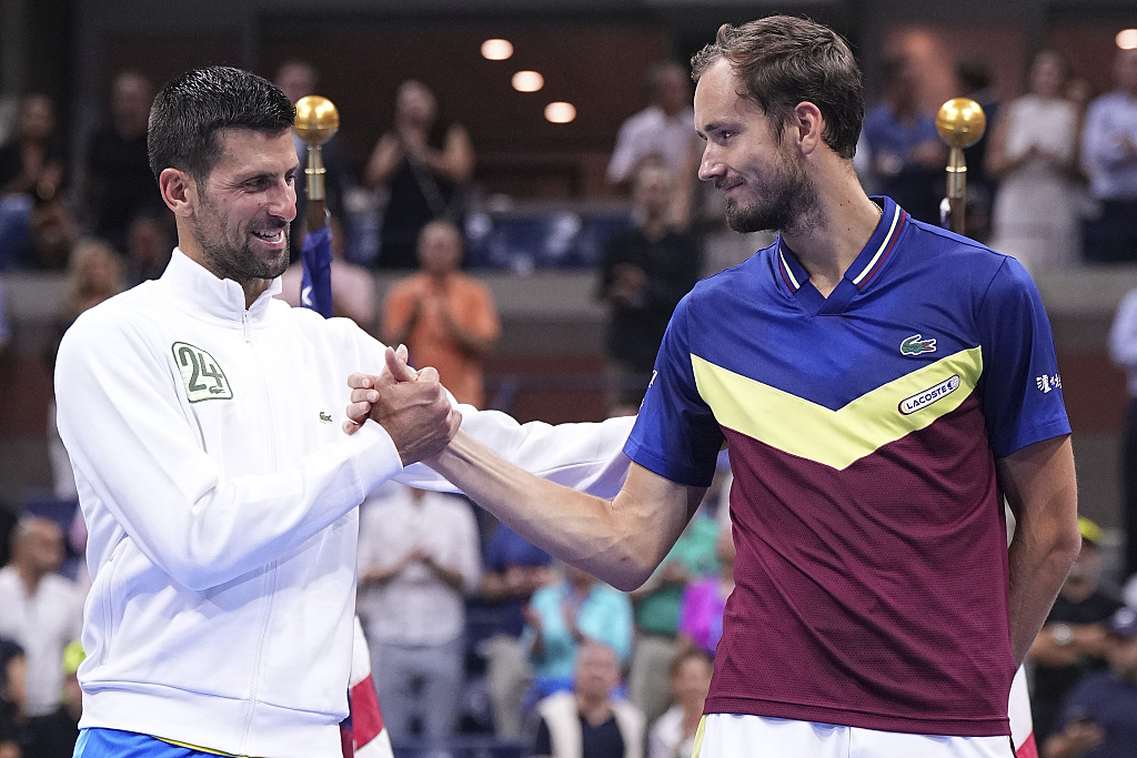 Novak Djokovic (L) shakes hands with Daniil Medvedev during the trophy presentation after the men's singles final of the U.S. Open in New York, U.S., September 10, 2023. /CFP
