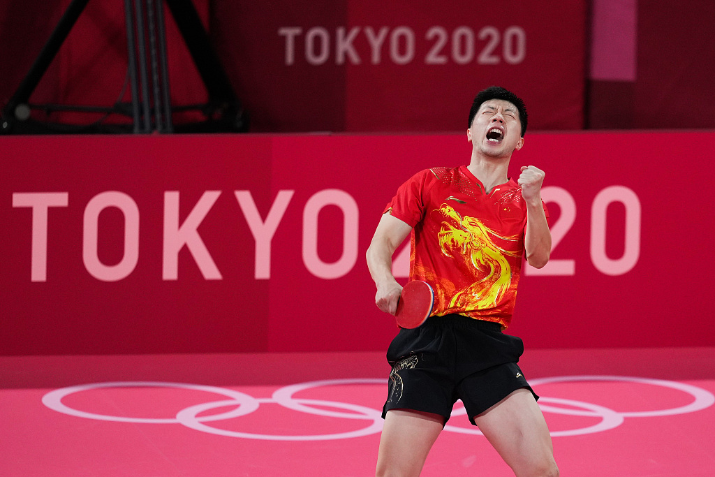 Ma Long celebrates after winning a game during the Tokyo 2020 Olympic Games in Tokyo, Japan, July 29, 2021. /CFP 