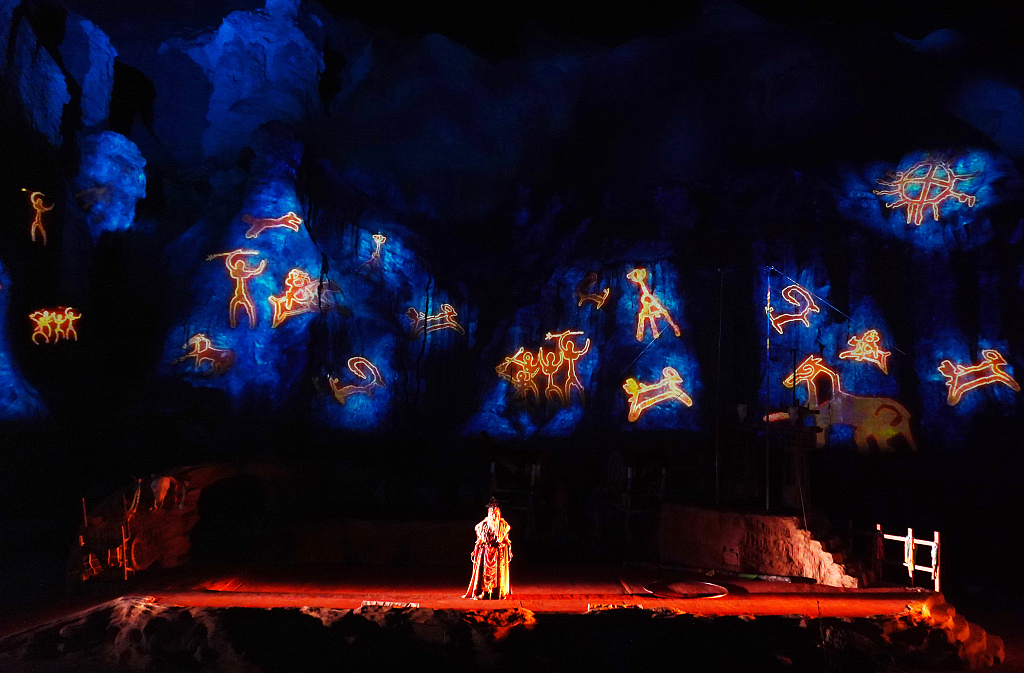 A photo taken on September 10, 2023, shows a stage below the Danxia landforms during a performance of 'Alan Lagda' in Zhangye, Gansu. /CFP
