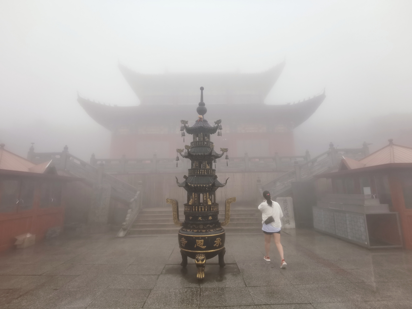 A tourist visits Cheng'en Temple on Mount Fanjing, in Tongren, southwest China's Guizhou Province, on August 25, 2023. /CGTN