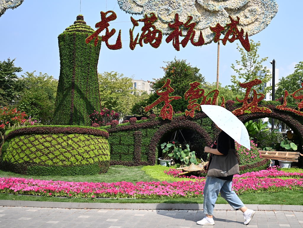 An Asian Games-themed flower landscape is seen on a street in Hangzhou, Zhejiang Province on September 11, 2023. /CFP